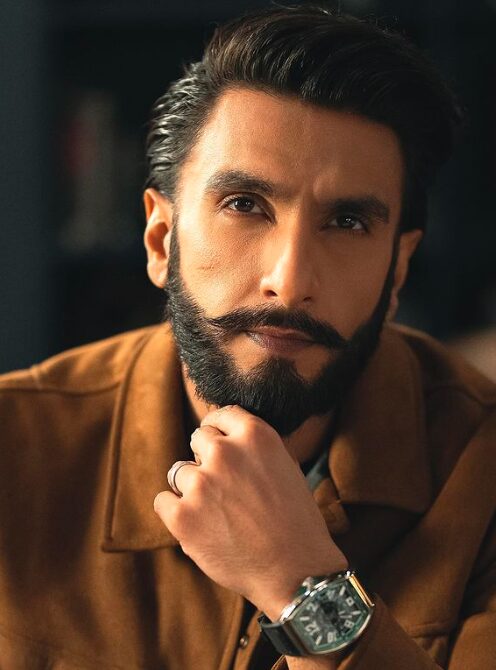 An image of Ranveer Singh smiling at the camera.